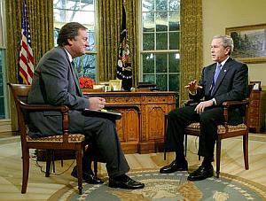 photo of Tim Russert and George W. Bush on Face the Nation, 2/8/04